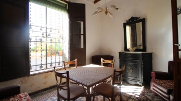 Large village house with stone patio.
