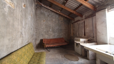 Large village house with stone patio.