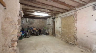 Large village house with stone patio.