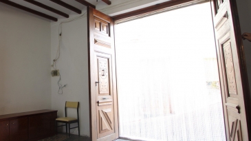 Large village house with stone patio.