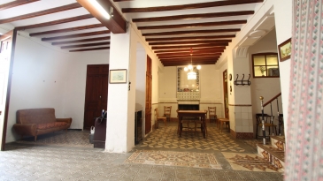 Large village house with stone patio.