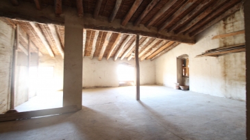 Large village house with stone patio.