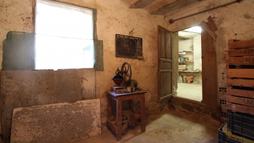 Large village house with stone patio.
