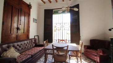 Large village house with stone patio.