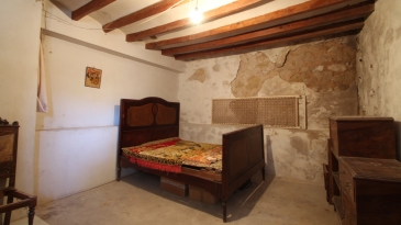 Large village house with stone patio.