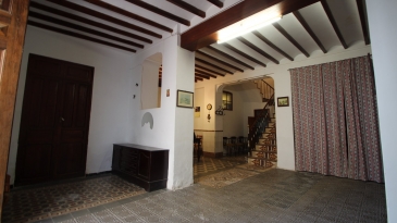 Large village house with stone patio.