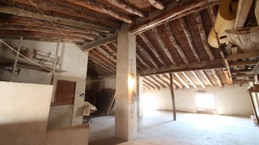 Large village house with stone patio.