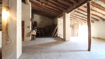 Large village house with stone patio.